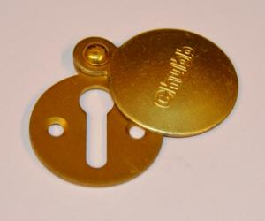 Flat brass Chubb escutcheon