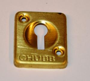 Rectangular brass Chubb escutcheon